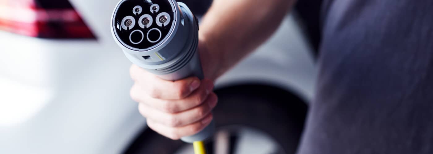 Motor oil being poured into an engine for maintenance.