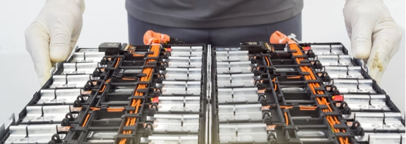 Motor oil being poured into an engine for maintenance.