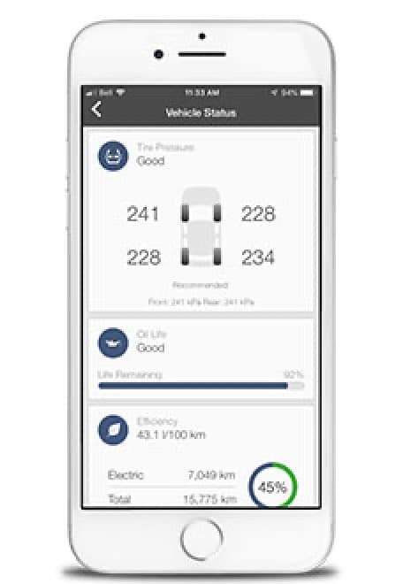 Smartphone displaying vehicle status app with tire pressure, oil life, and efficiency metrics.