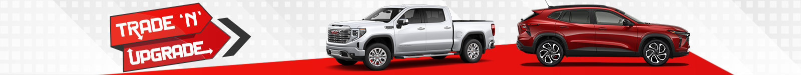 White truck and red SUV displayed with "Trade 'N' Upgrade" signage on red background.
